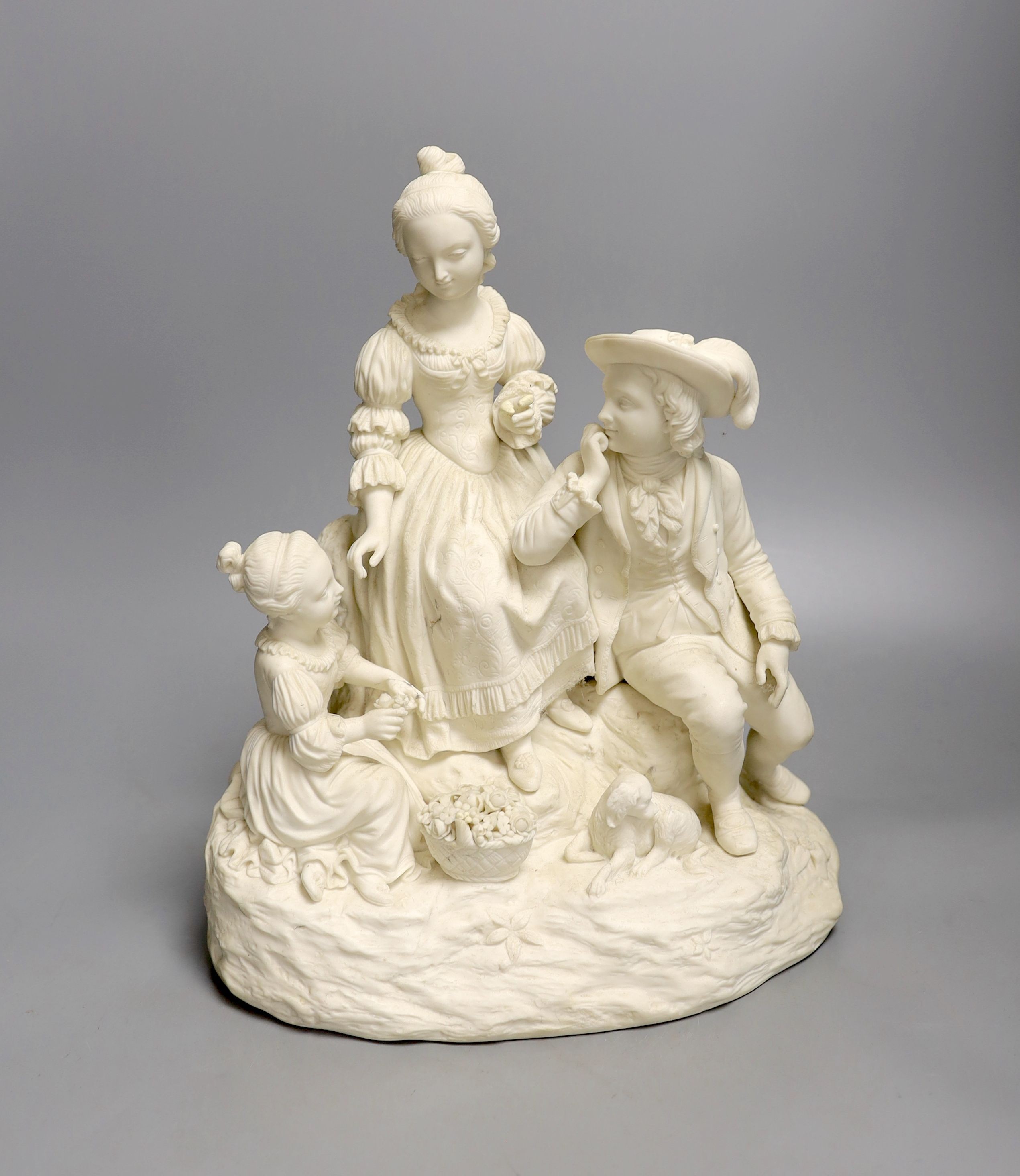 A 19th century Adams & Co. parian group of a man, woman, child and dog 31cm